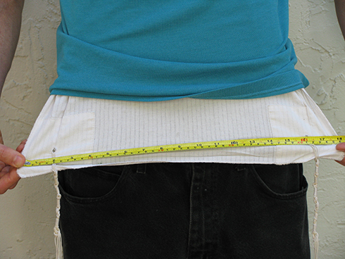 The minimum  width for a talit katan is 17 inches